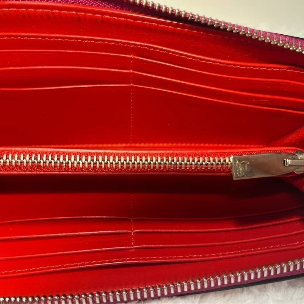 Christian Louboutin Zip Around Panetone Studded wallet in Wine Color, Leather